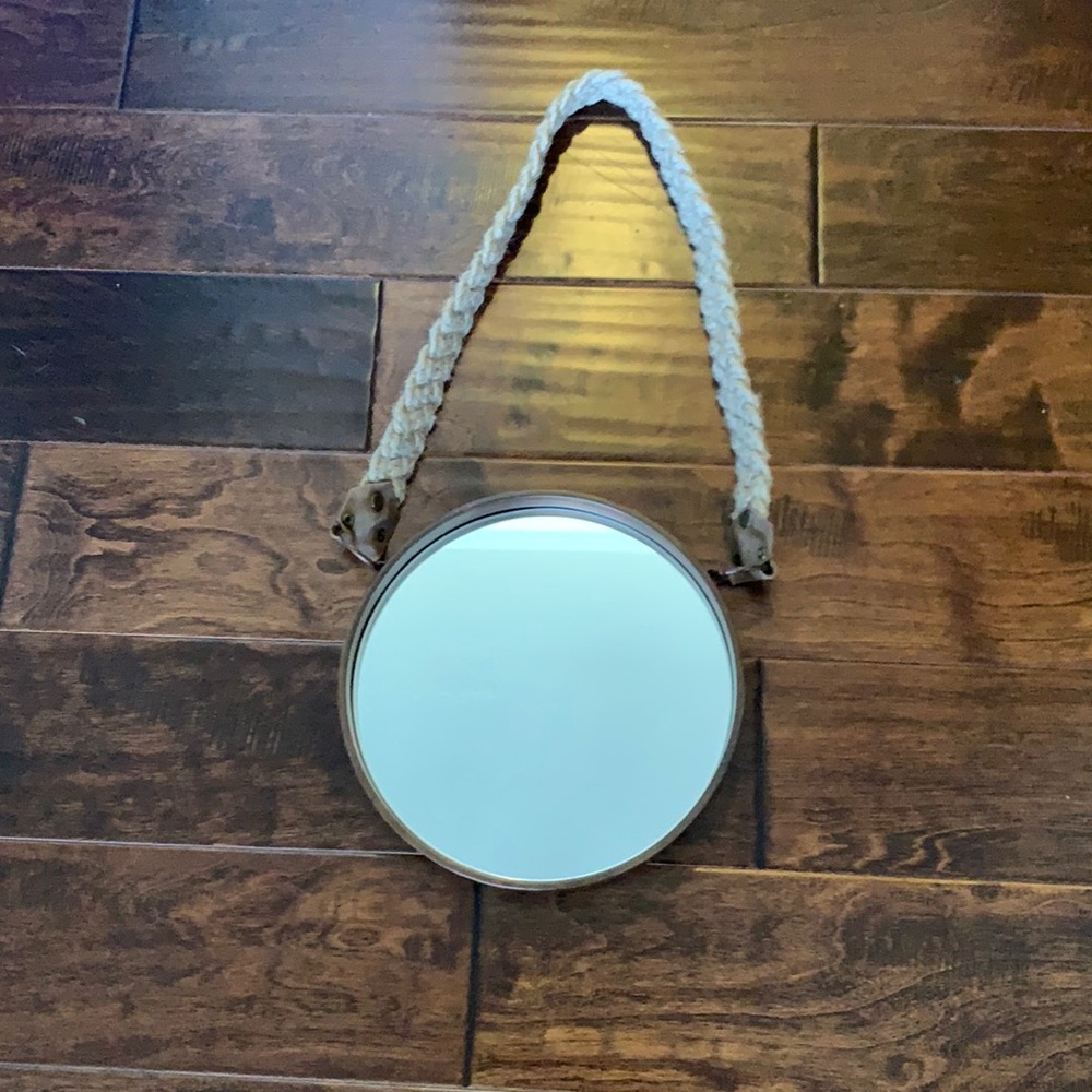 circle mirror with braided rope as an accent hangar